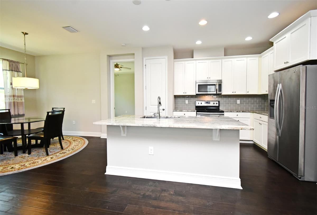 8742 PEACHTREE PARK CT — photo 9 of 38