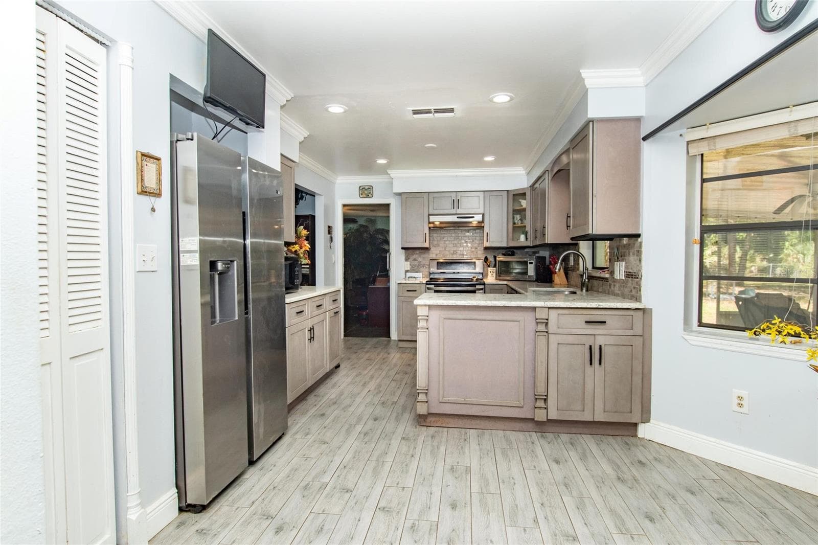 4022 CANAVERAL GROVES BOULEVARD — photo 4 of 50