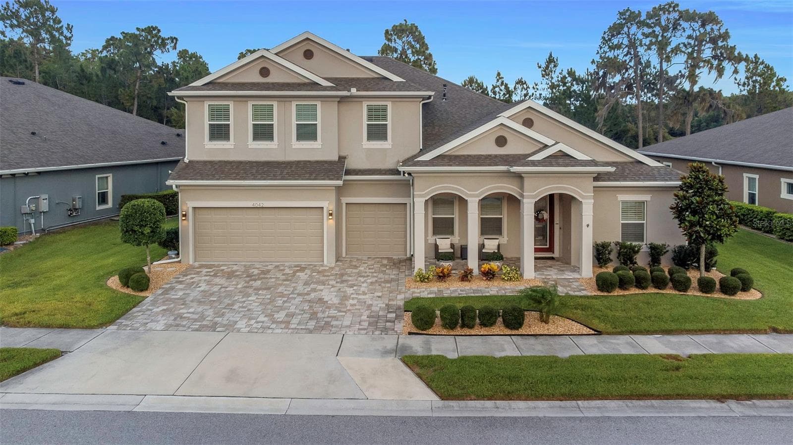 4042 WOODLAND RETREAT BOULEVARD — photo 1 of 93