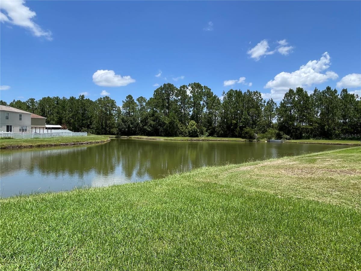 5036 WHISTLING PINES COURT — photo 2 of 33