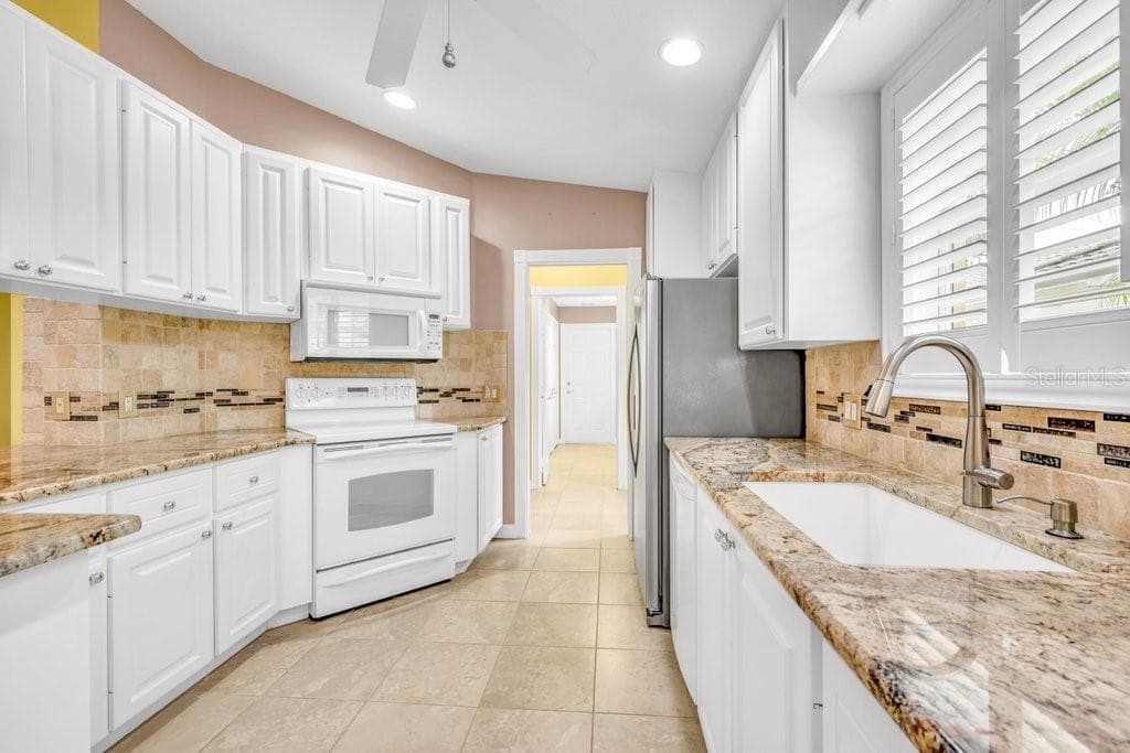 7617 CAMMINARE DRIVE — photo 6 of 64