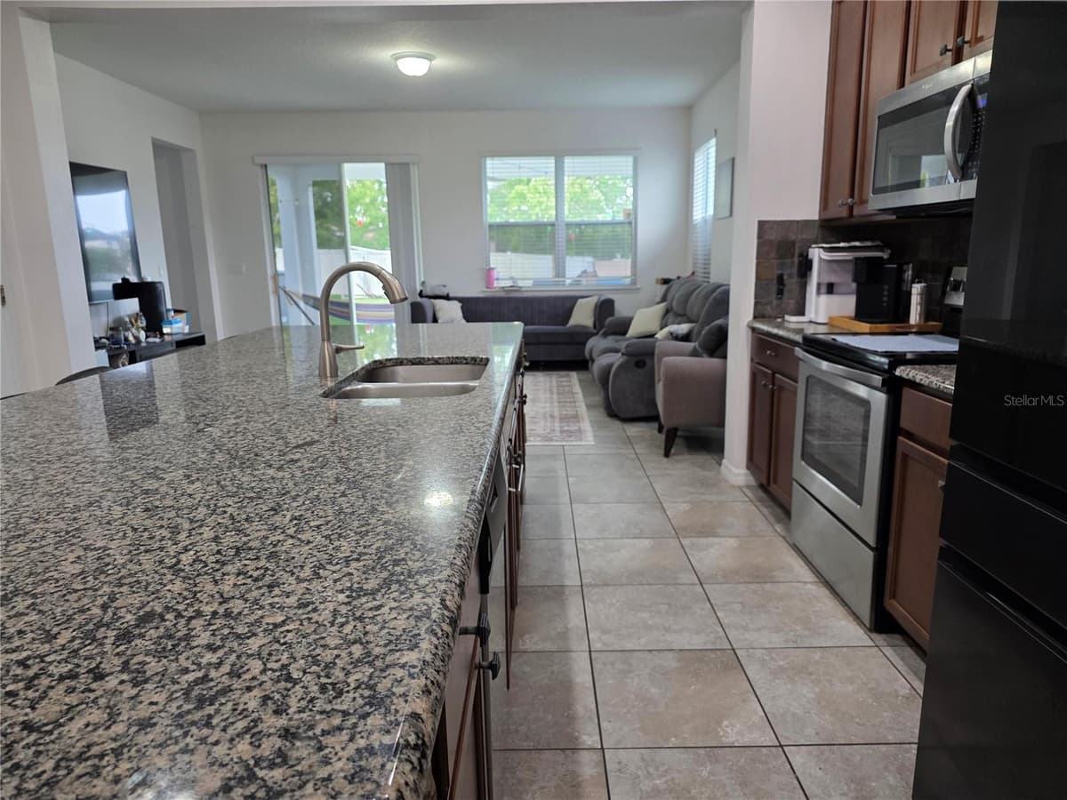 12749 GARRIDAN AVENUE — photo 4 of 36