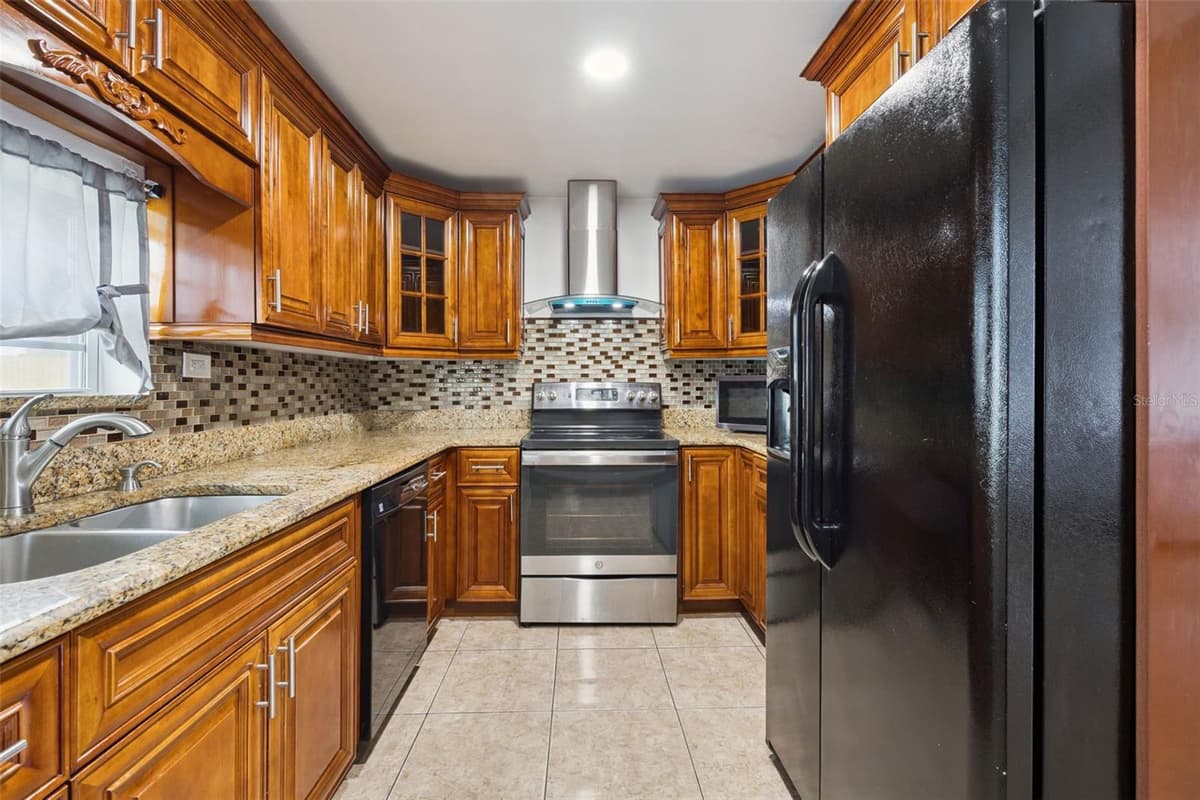 5907 DAHLIA DRIVE — photo 9 of 34
